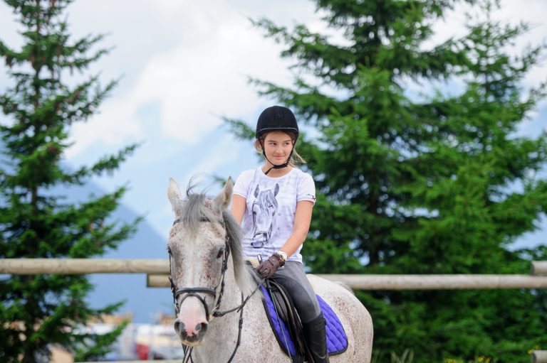 Activities in Verbier - girl riding a horse