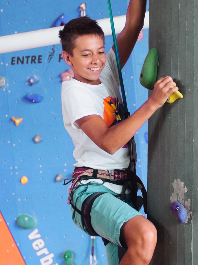 Activities and Excursions - boy climbing an indoor climbing wall