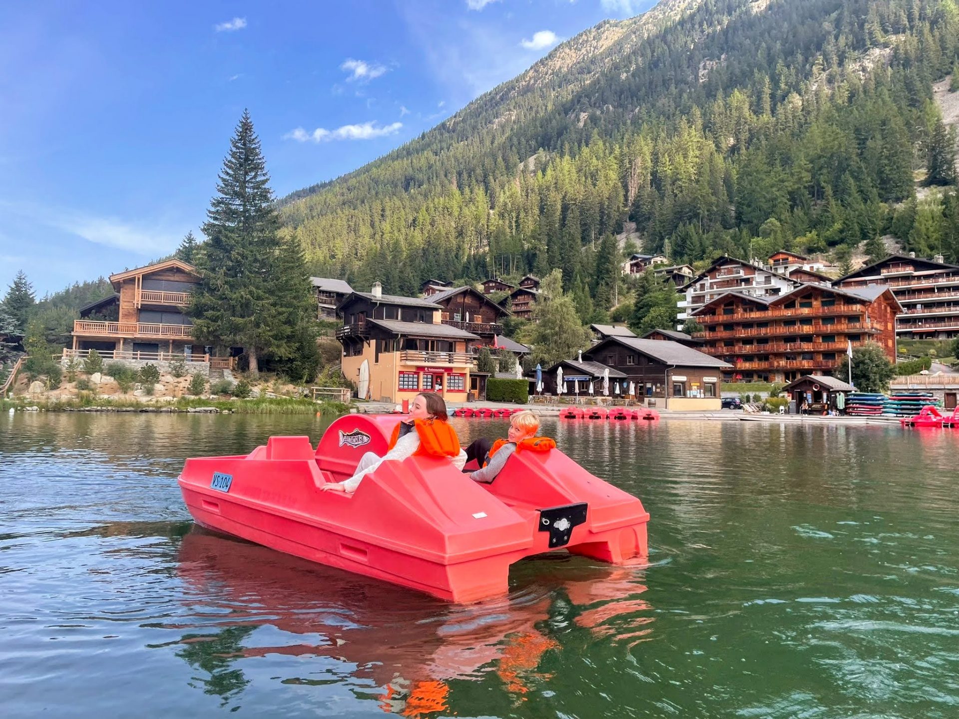 kids using pedalos on a champex lac day trip
