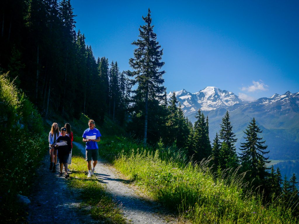 Altitude Summer Camps instructor walking with children in Verbier summer mountain scenery